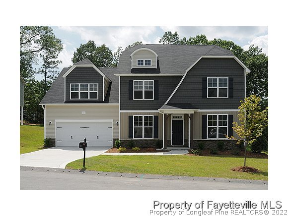 57 Ginseng Street Spring Lake, NC 28390 - Photo 1 of 25 a front view of a house with a yard