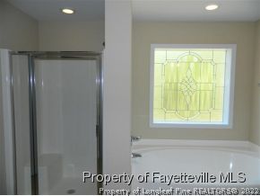 57 Ginseng Street Spring Lake, NC 28390 - Photo 12 of 25 a view of a livingroom with an empty space and a window