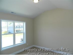 57 Ginseng Street Spring Lake, NC 28390 - Photo 16 of 25 a view of an empty room and a window
