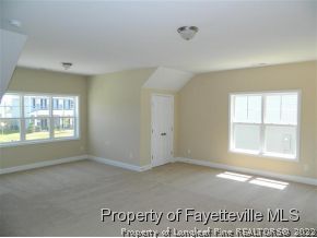 57 Ginseng Street Spring Lake, NC 28390 - Photo 20 of 25 a view of an empty room with a window