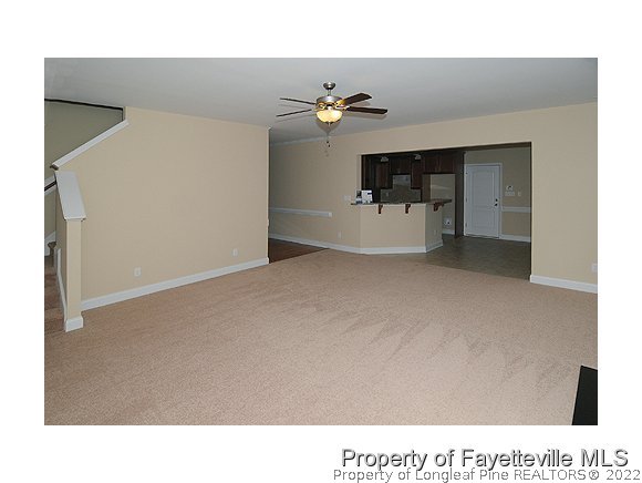 57 Ginseng Street Spring Lake, NC 28390 - Photo 6 of 25 a living room with furniture and kitchen view