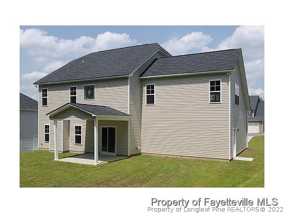 57 Ginseng Street Spring Lake, NC 28390 - Photo 10 of 25 a front view of a house with a yard