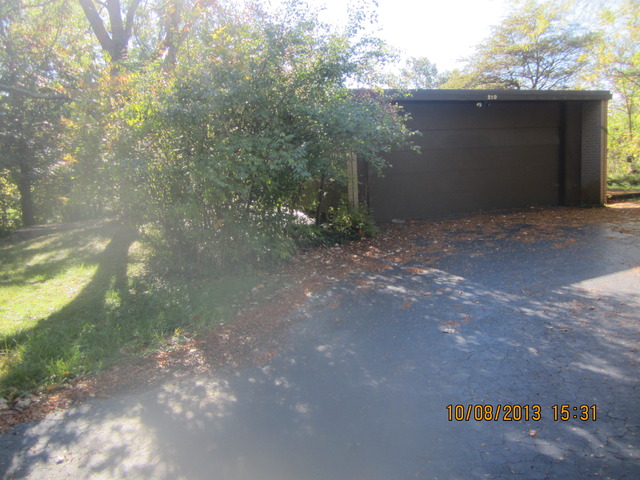 210 Denell Drive Crete, IL 60417 - Photo 1 of 11 a view of a yard with large trees