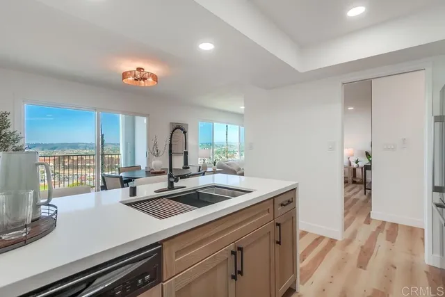 a kitchen with a sink and a stove top oven