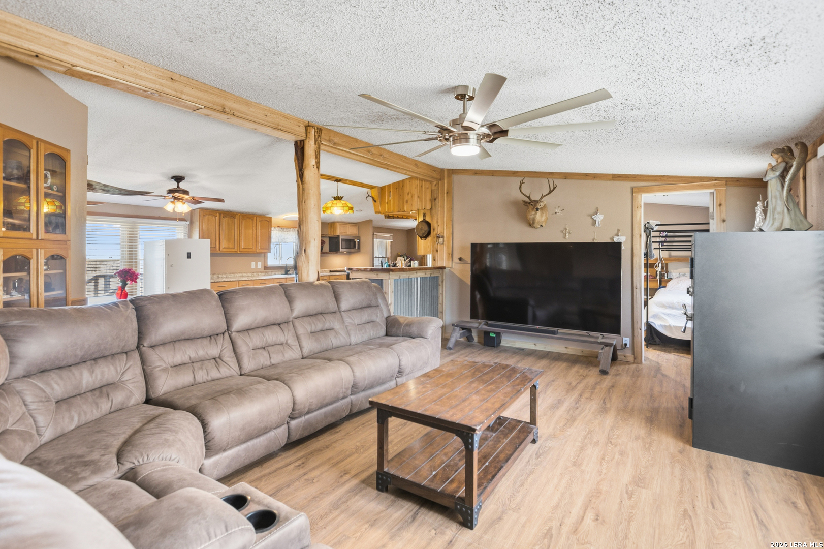 470 Lyon Road Seguin, TX 78155 - Photo 19 of 43 a living room with furniture and a flat screen tv