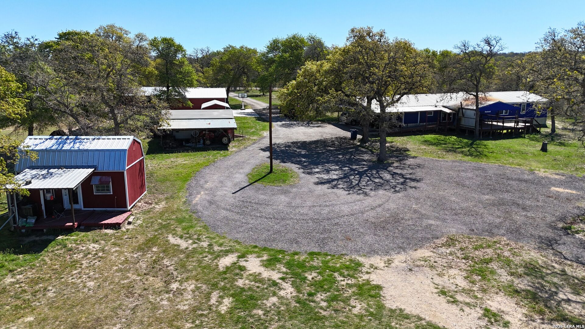 470 Lyon Road Seguin, TX 78155 - Photo 2 of 43 a front view of a house with a garden and sitting area