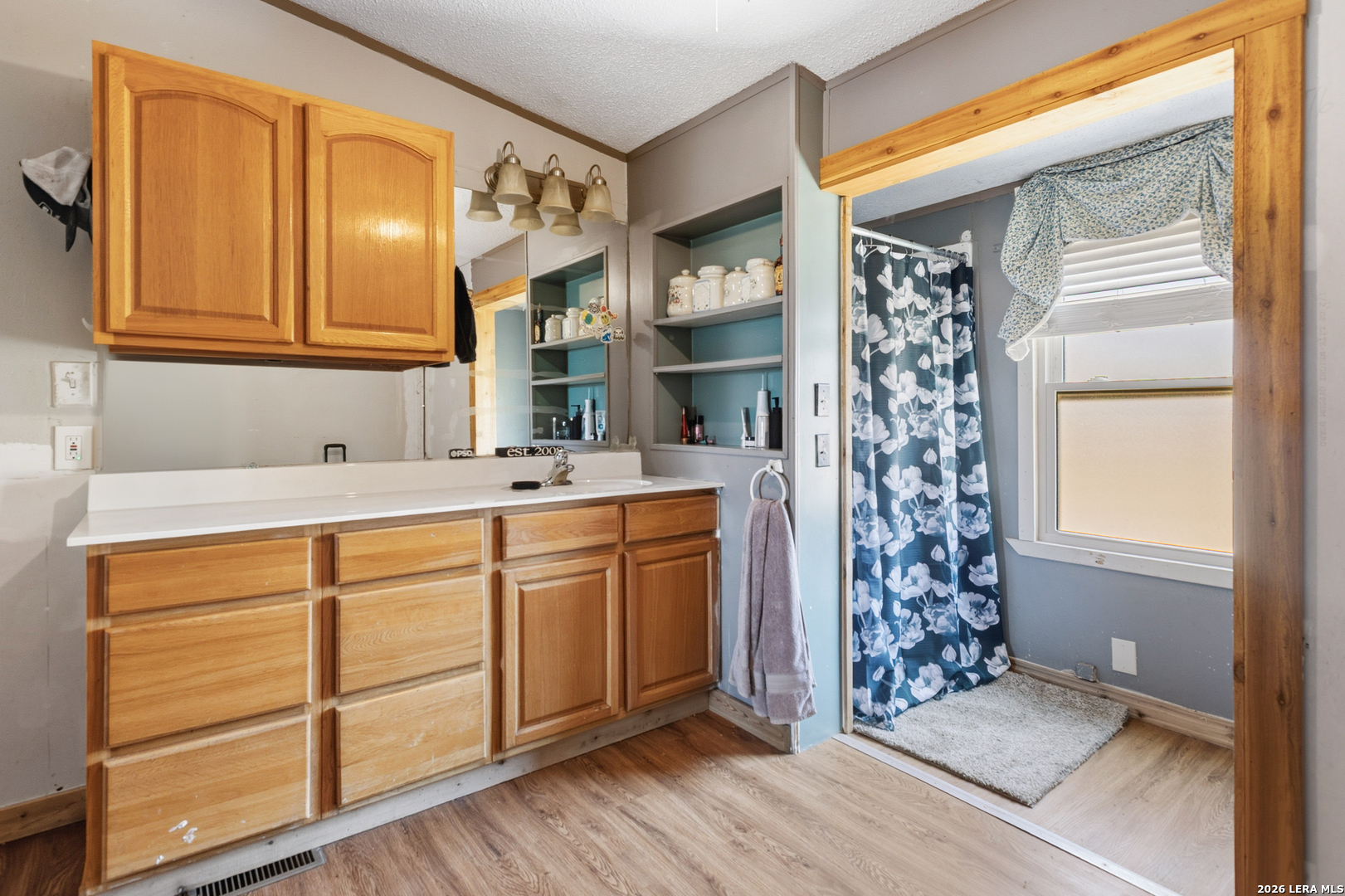 470 Lyon Road Seguin, TX 78155 - Photo 31 of 43 a bathroom with a sink and a mirror