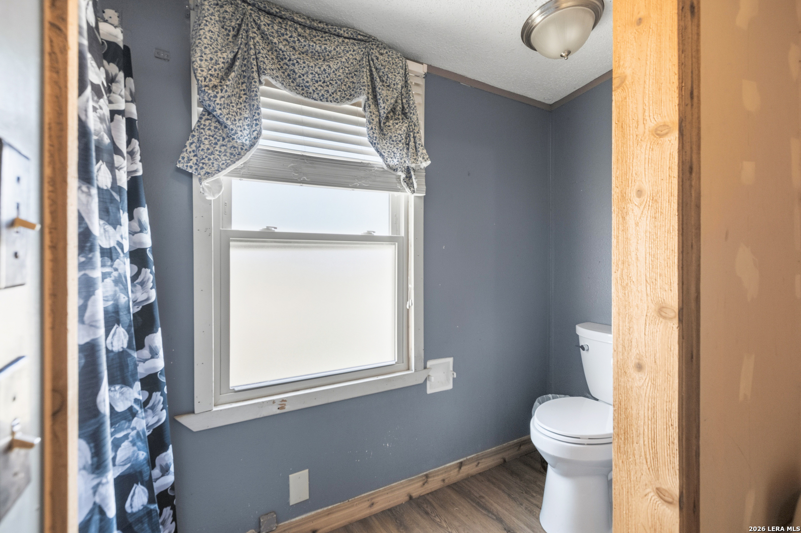 470 Lyon Road Seguin, TX 78155 - Photo 33 of 43 a bathroom with a white toilet and a window