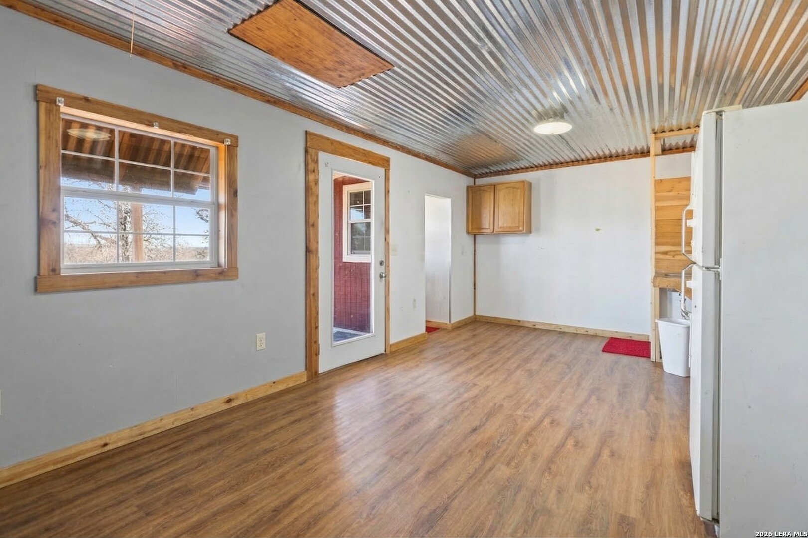 470 Lyon Road Seguin, TX 78155 - Photo 36 of 43 a view of an empty room with wooden floor and a window