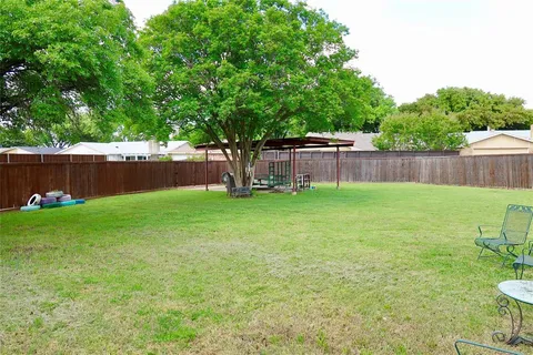 a view of a backyard with a small cabin