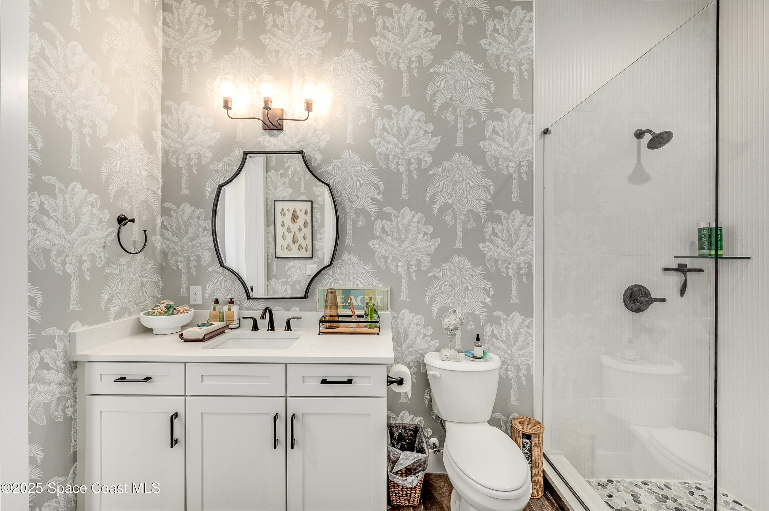 225 Strand Drive, Unit 404 Melbourne Beach, FL 32951 - Photo 12 of 51 a bathroom with a toilet and a sink