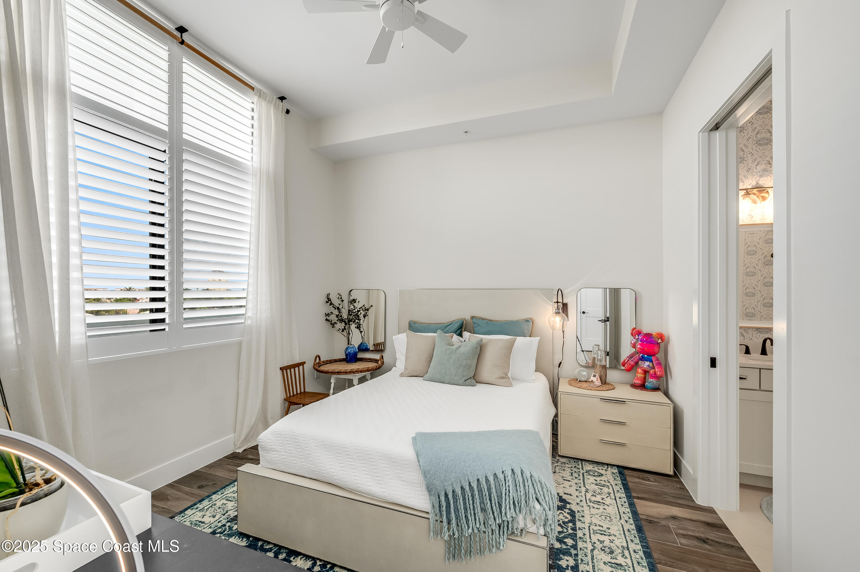 225 Strand Drive, Unit 404 Melbourne Beach, FL 32951 - Photo 14 of 51 a bedroom with a bed and window