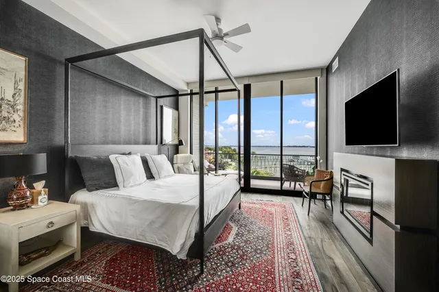 a bed room with a bed and a television