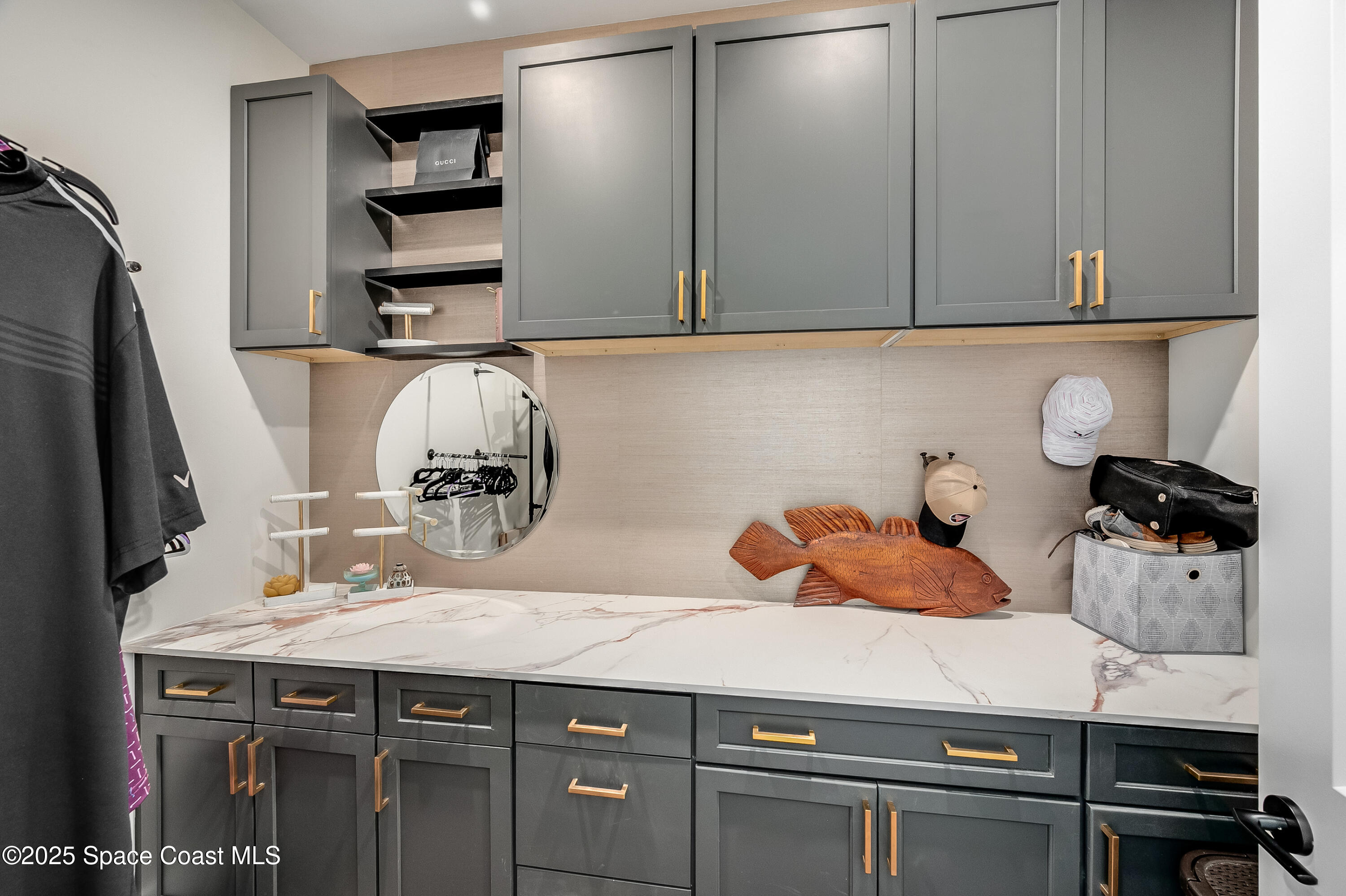 225 Strand Drive, Unit 404 Melbourne Beach, FL 32951 - Photo 21 of 51 a kitchen with a sink and cabinets