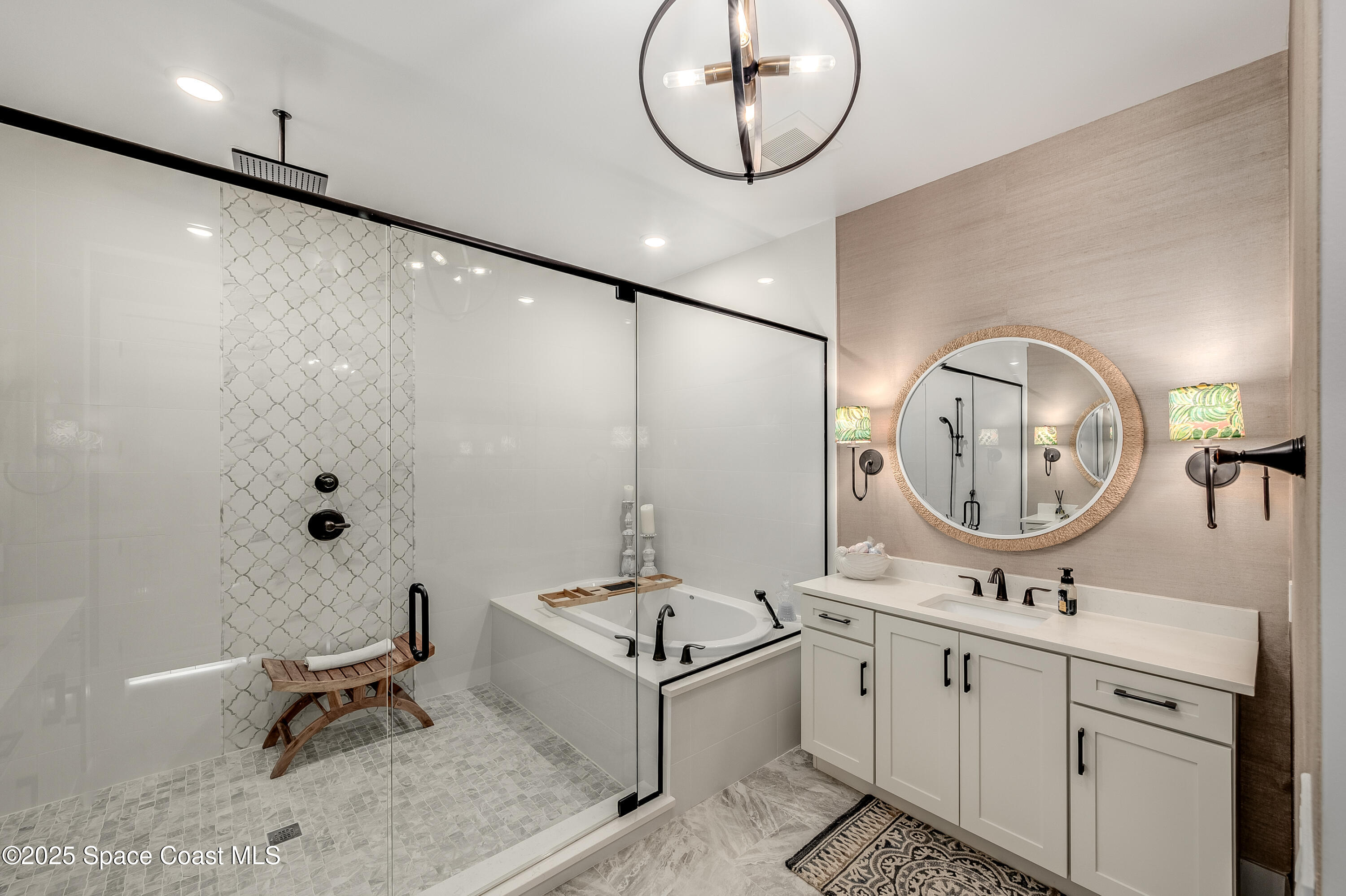 225 Strand Drive, Unit 404 Melbourne Beach, FL 32951 - Photo 23 of 51 a bathroom with a sink and a mirror