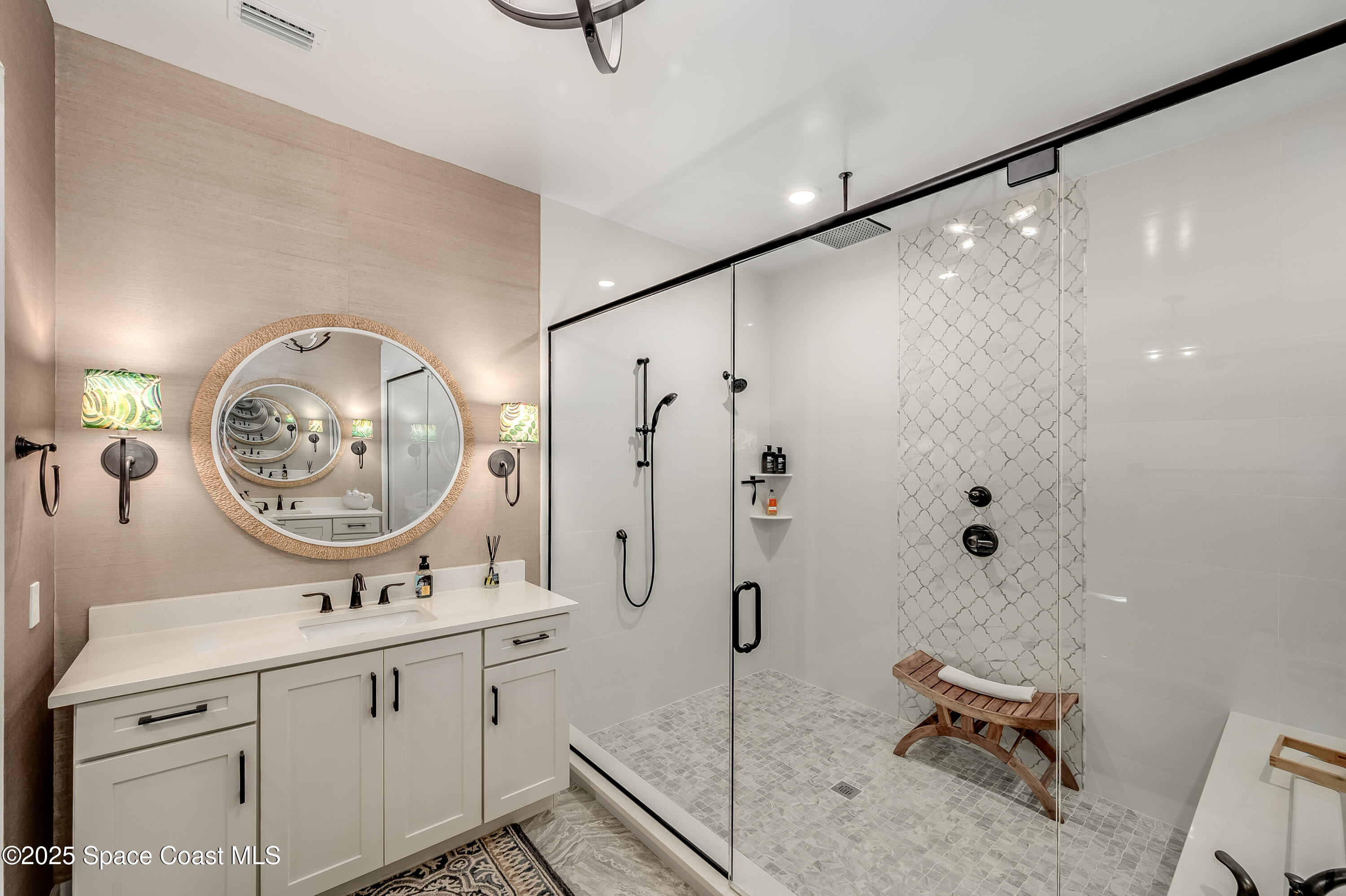 225 Strand Drive, Unit 404 Melbourne Beach, FL 32951 - Photo 24 of 51 a bathroom with a sink mirror vanity and toilet
