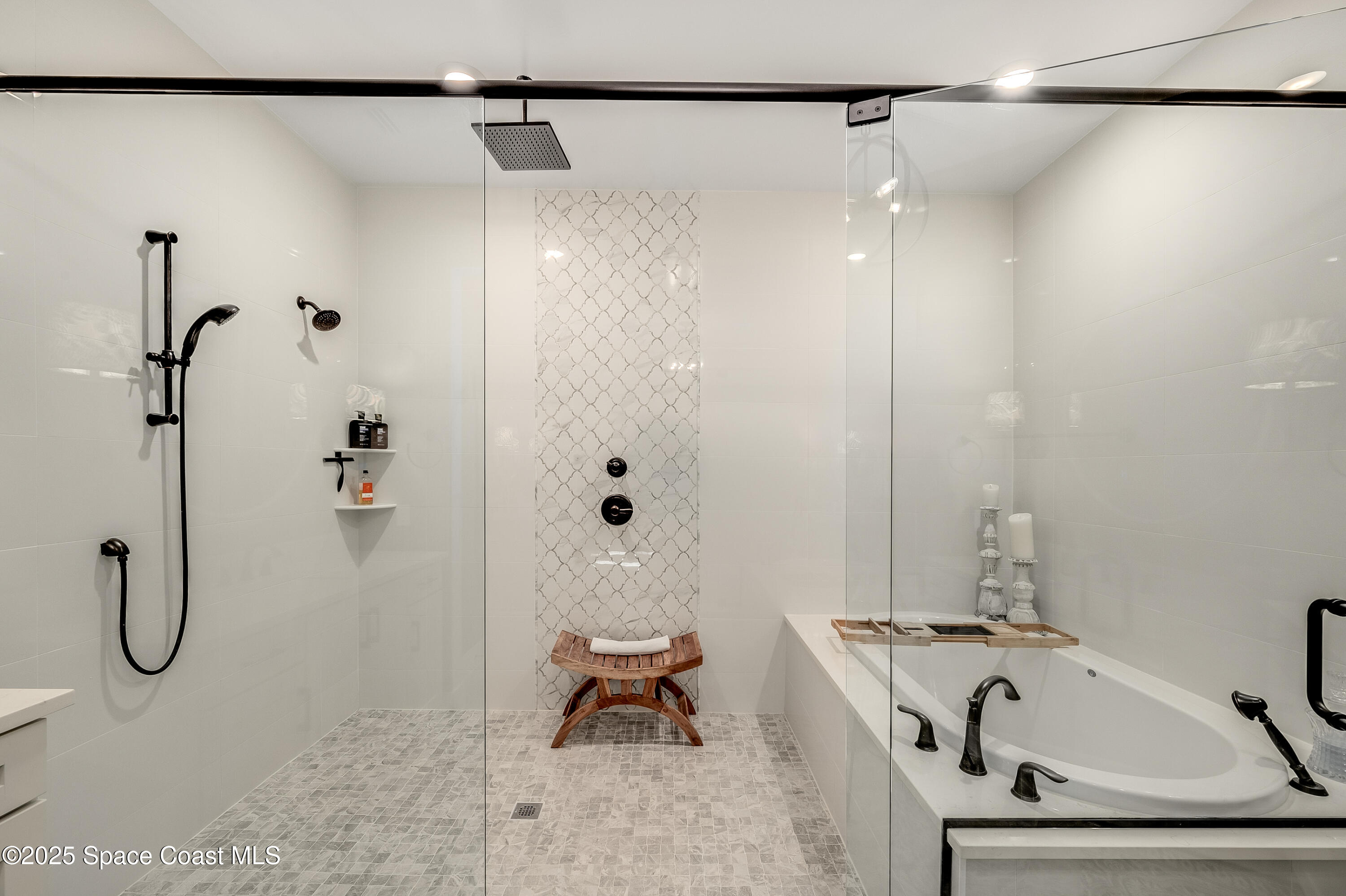 225 Strand Drive, Unit 404 Melbourne Beach, FL 32951 - Photo 25 of 51 a bathroom with a tub and shower