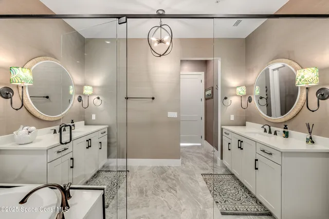 a bathroom with a sink double vanity and a mirror