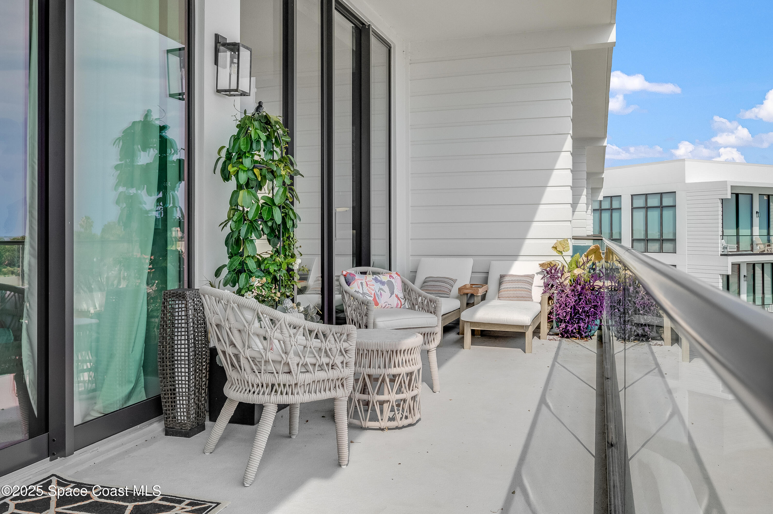 225 Strand Drive, Unit 404 Melbourne Beach, FL 32951 - Photo 39 of 51 a view of an outdoor sitting area with furniture