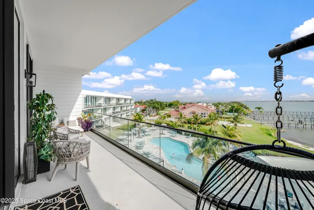 a view of swimming pool with an outdoor seating