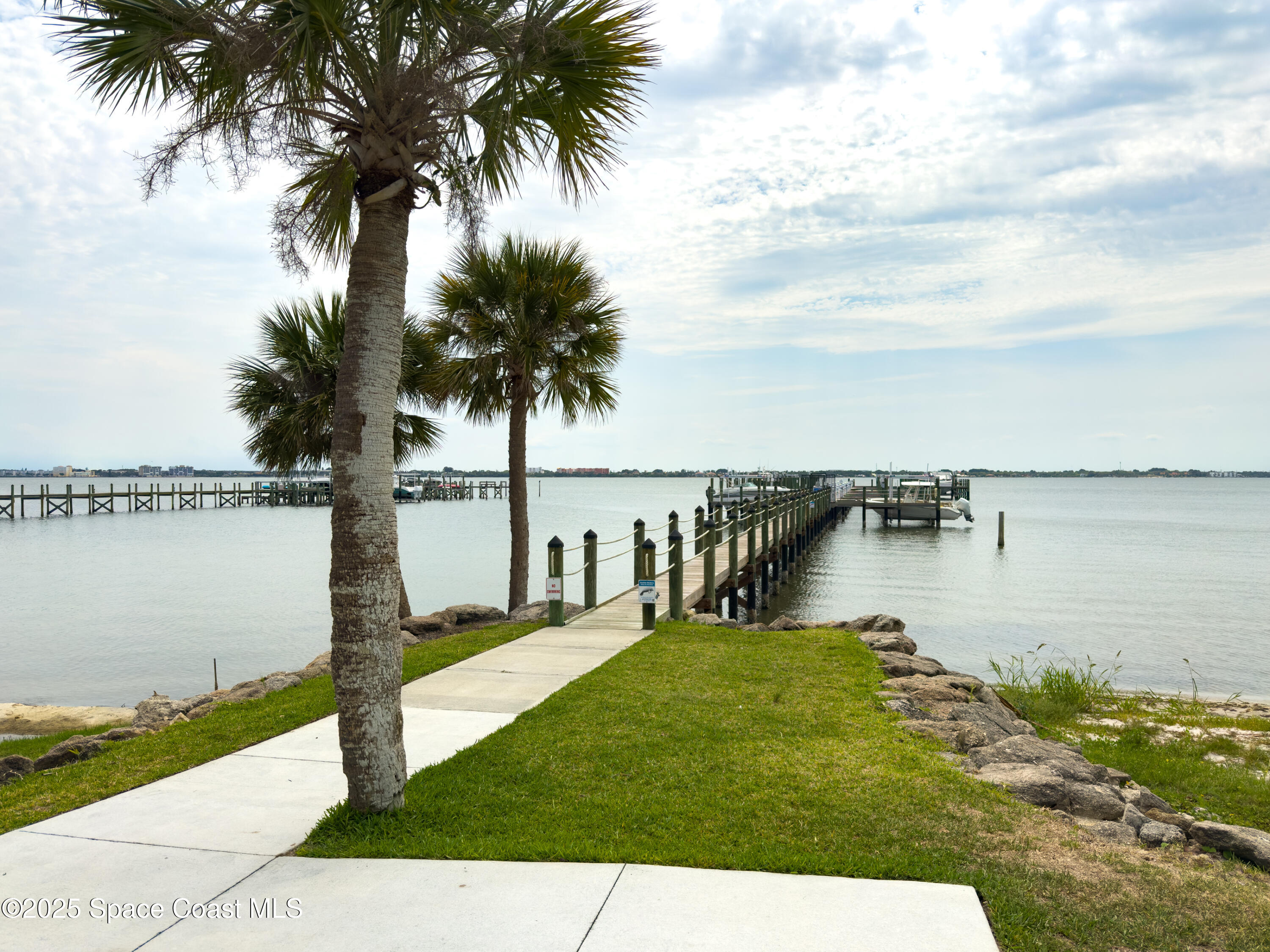 225 Strand Drive, Unit 404 Melbourne Beach, FL 32951 - Photo 42 of 51 a view of a lake with a garden