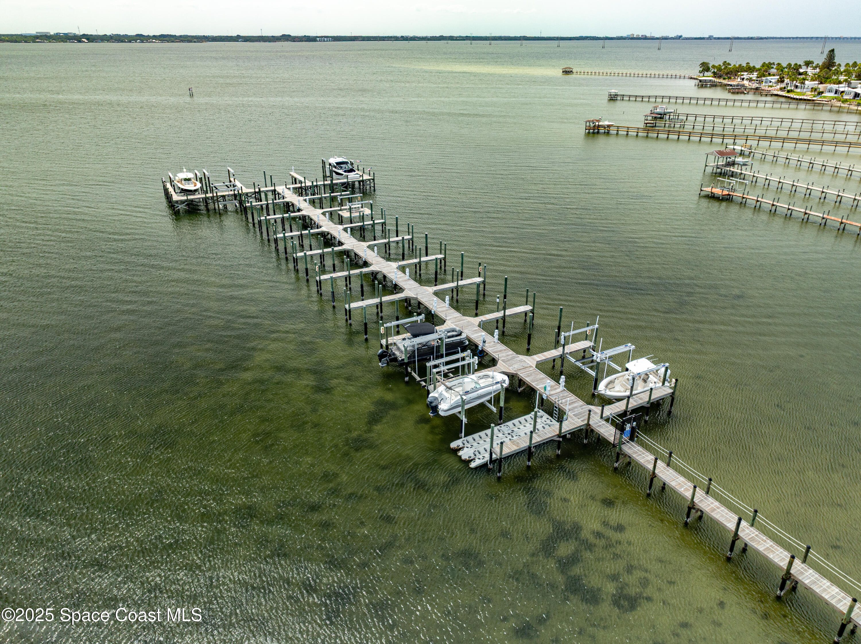 225 Strand Drive, Unit 404 Melbourne Beach, FL 32951 - Photo 49 of 51 a view of an ocean with boats