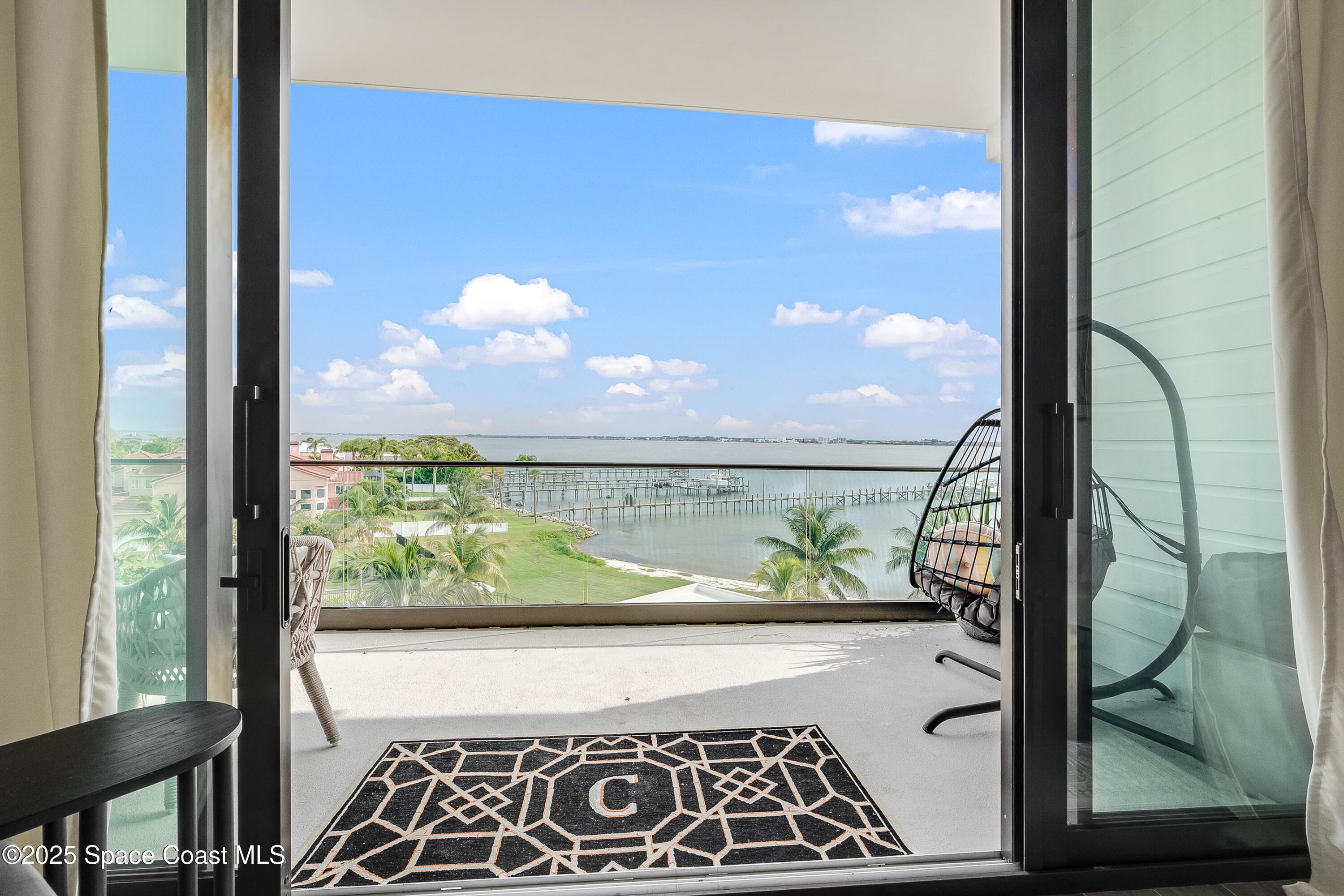 225 Strand Drive, Unit 404 Melbourne Beach, FL 32951 - Photo 5 of 51 a view of a glass door
