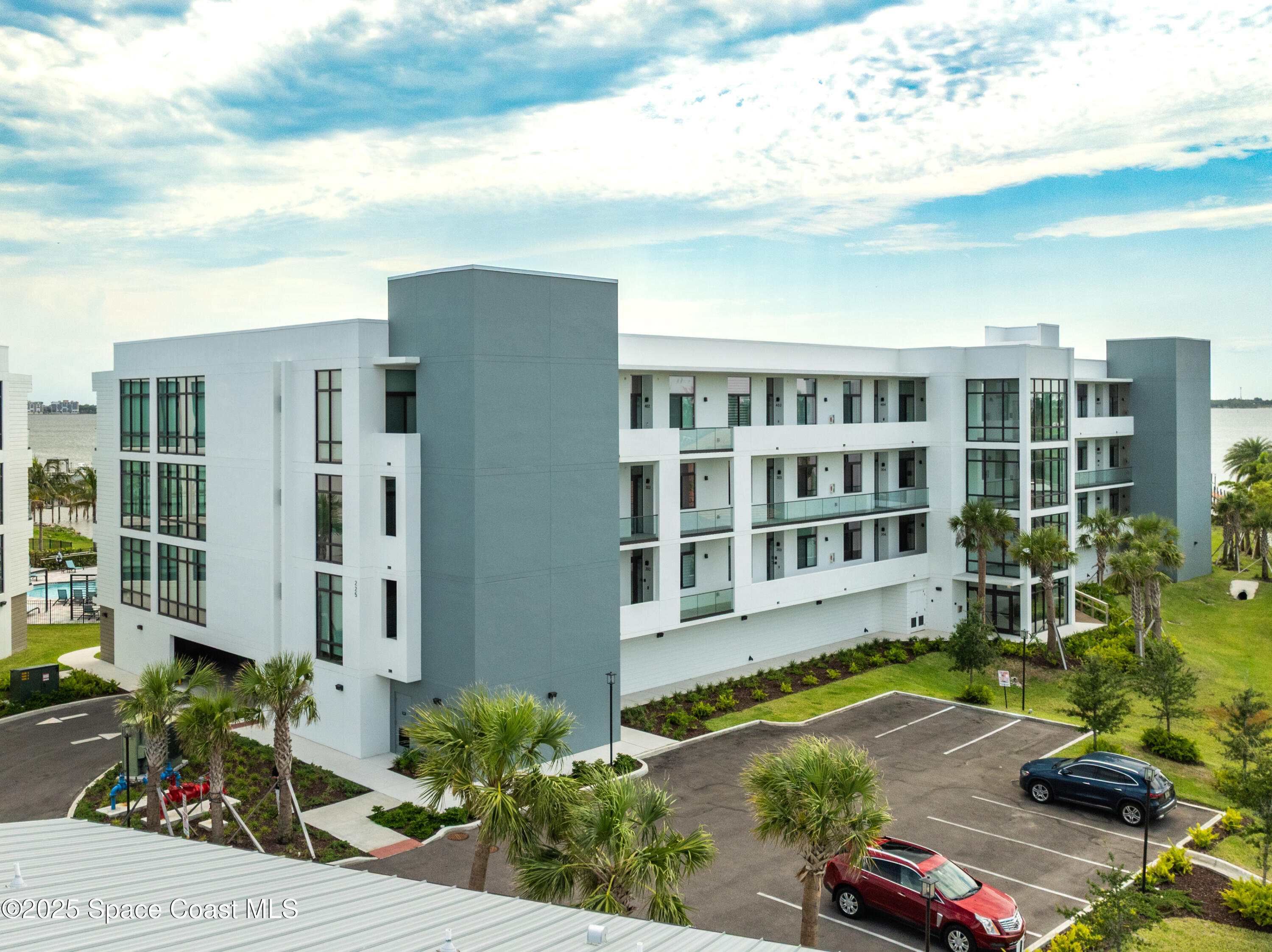 225 Strand Drive, Unit 404 Melbourne Beach, FL 32951 - Photo 51 of 51 a view of residential houses with yard and potted plants