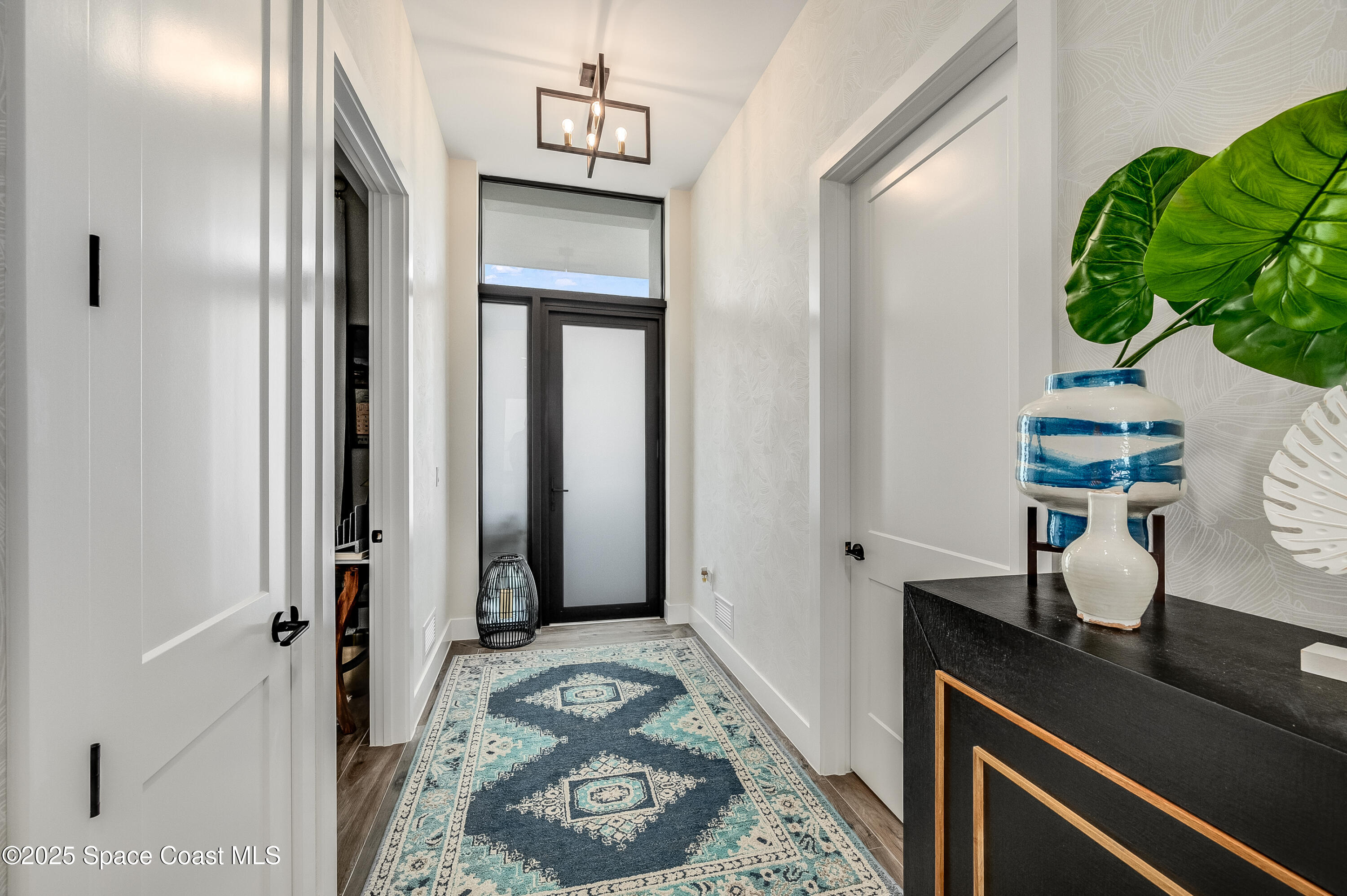 225 Strand Drive, Unit 404 Melbourne Beach, FL 32951 - Photo 9 of 51 a view of bathroom with a potted plant on a sink and a mirror