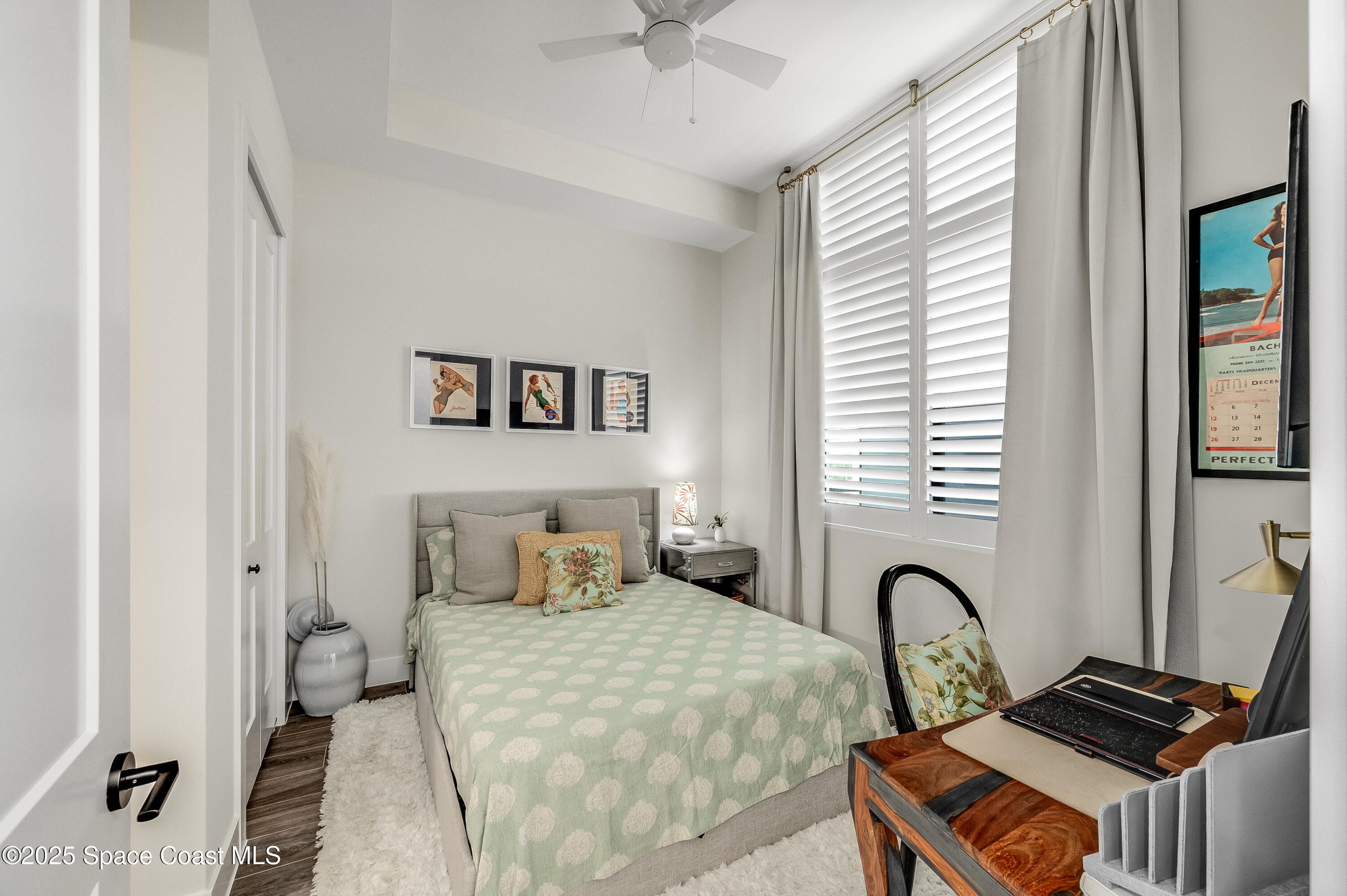 225 Strand Drive, Unit 404 Melbourne Beach, FL 32951 - Photo 10 of 51 a bedroom with a bed and a window