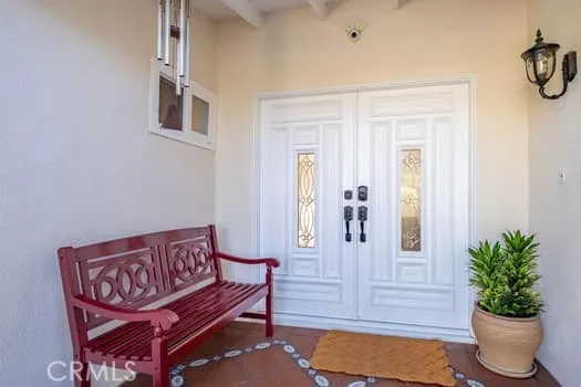 a view of a hallway with seating area