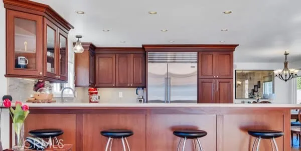 a kitchen with stainless steel appliances a sink and cabinets
