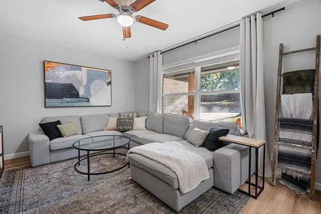 a living room with furniture and a window