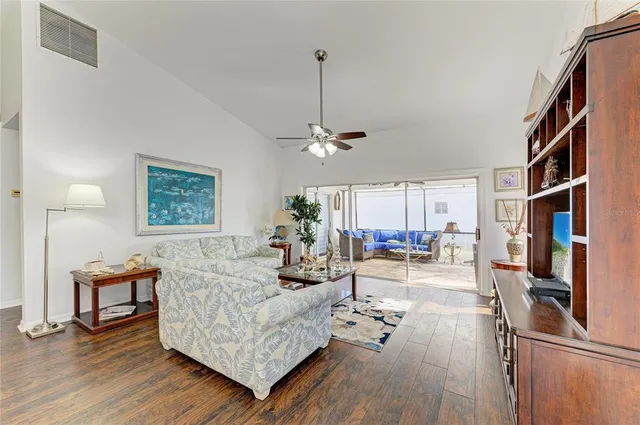 a kitchen with a sink a counter top space cabinets and stainless steel appliances