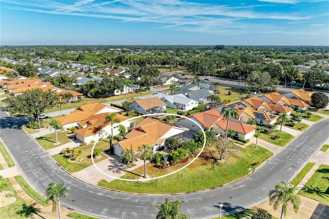 an aerial view of a house with a swimming pool