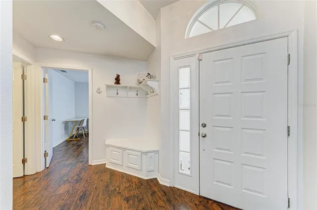 an aerial view of a residential houses with outdoor space