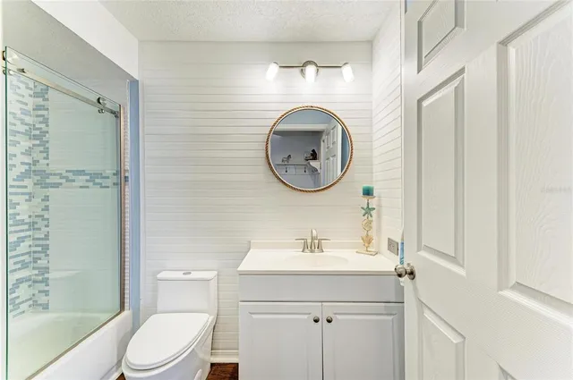 an aerial view of a house a yard swimming pool and outdoor seating