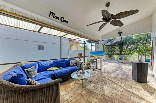 a view of backyard with table and chairs and potted plants
