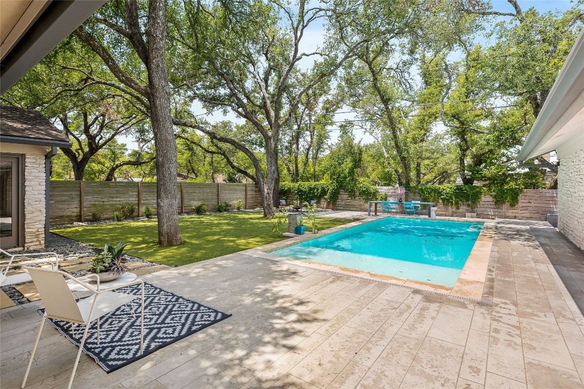 a view of a backyard with a patio