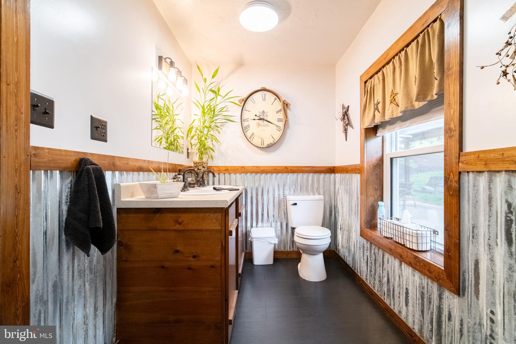13127 Manor Furnace Road Brogue, PA 17309 - Photo 28 of 78 a bathroom with a toilet a sink and a large mirror
