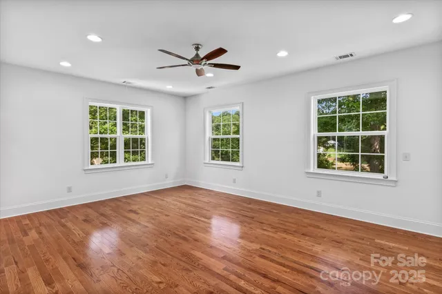 a bathroom with a granite countertop sink a toilet and bathtub
