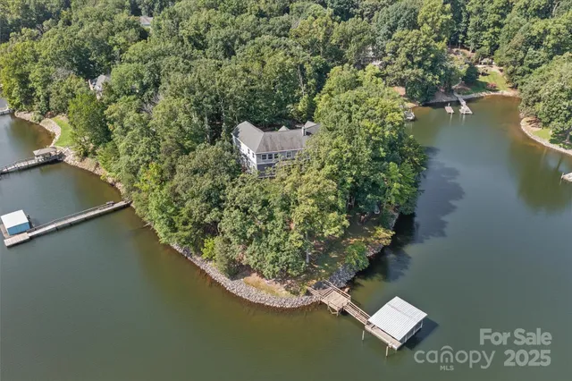 an aerial view of a houses with lake view