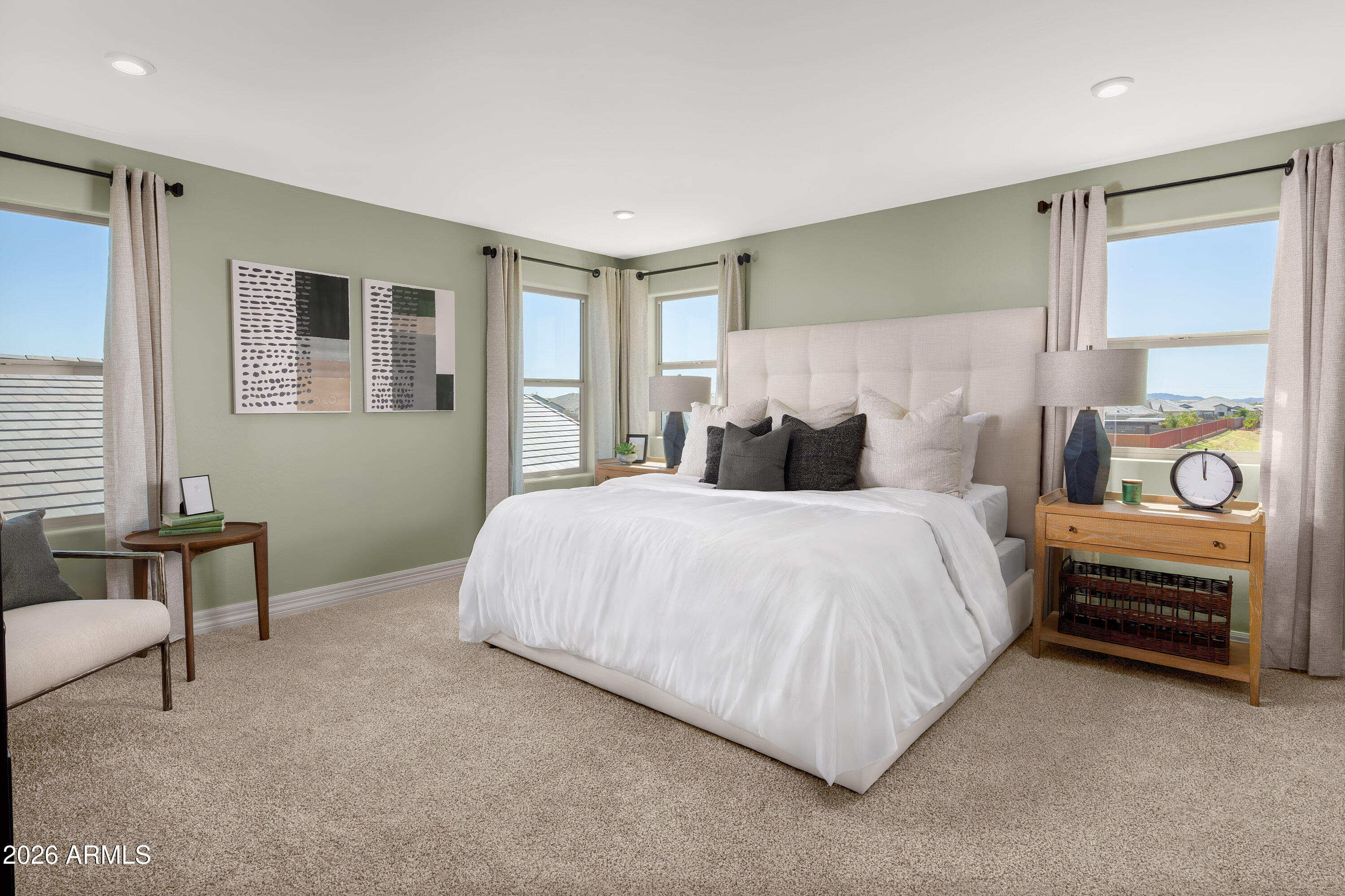 18828 North Ponte Road Maricopa, AZ 85138 - Photo 11 of 25 a bedroom with a bed and a chair