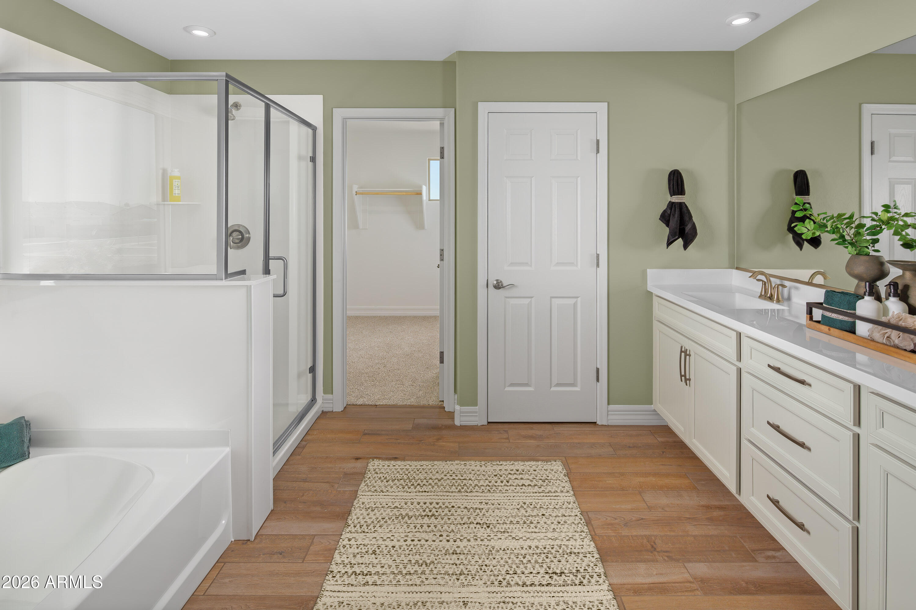 18828 North Ponte Road Maricopa, AZ 85138 - Photo 13 of 25 a bathroom with a tub shower vanity and a sink