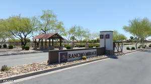 18828 North Ponte Road Maricopa, AZ 85138 - Photo 16 of 25 a view of a street with a building in the background