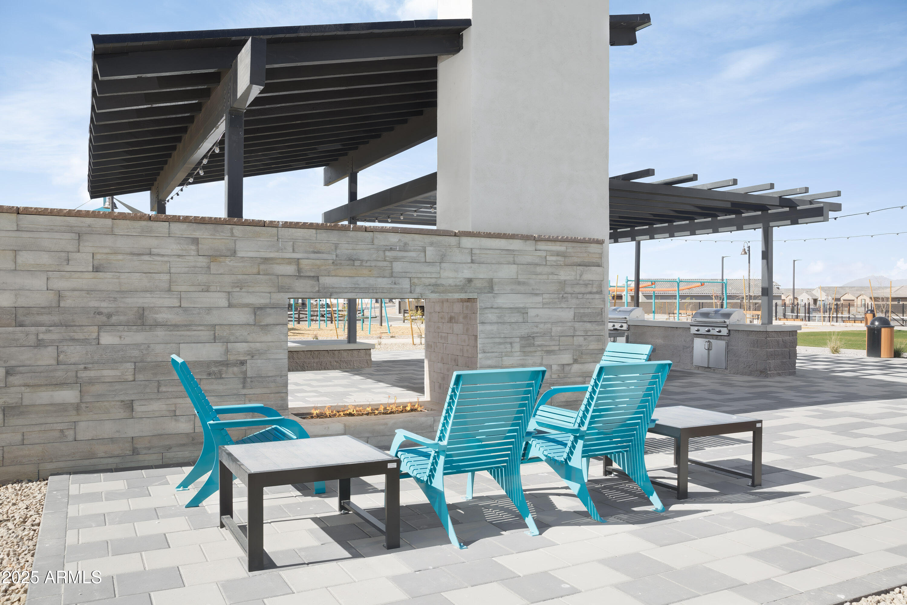 18828 North Ponte Road Maricopa, AZ 85138 - Photo 18 of 25 a view of an chairs and tables in the patio