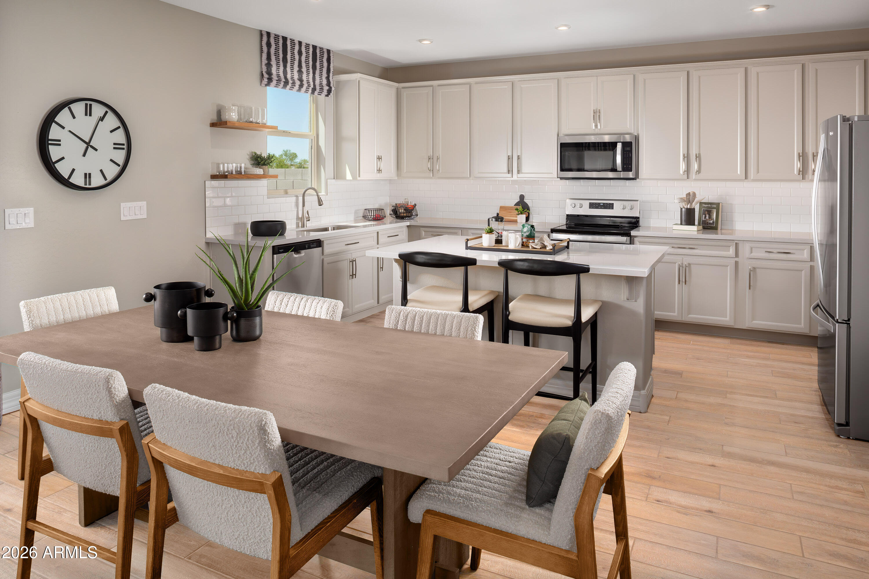 18828 North Ponte Road Maricopa, AZ 85138 - Photo 2 of 25 a view of kitchen with dining table and chairs