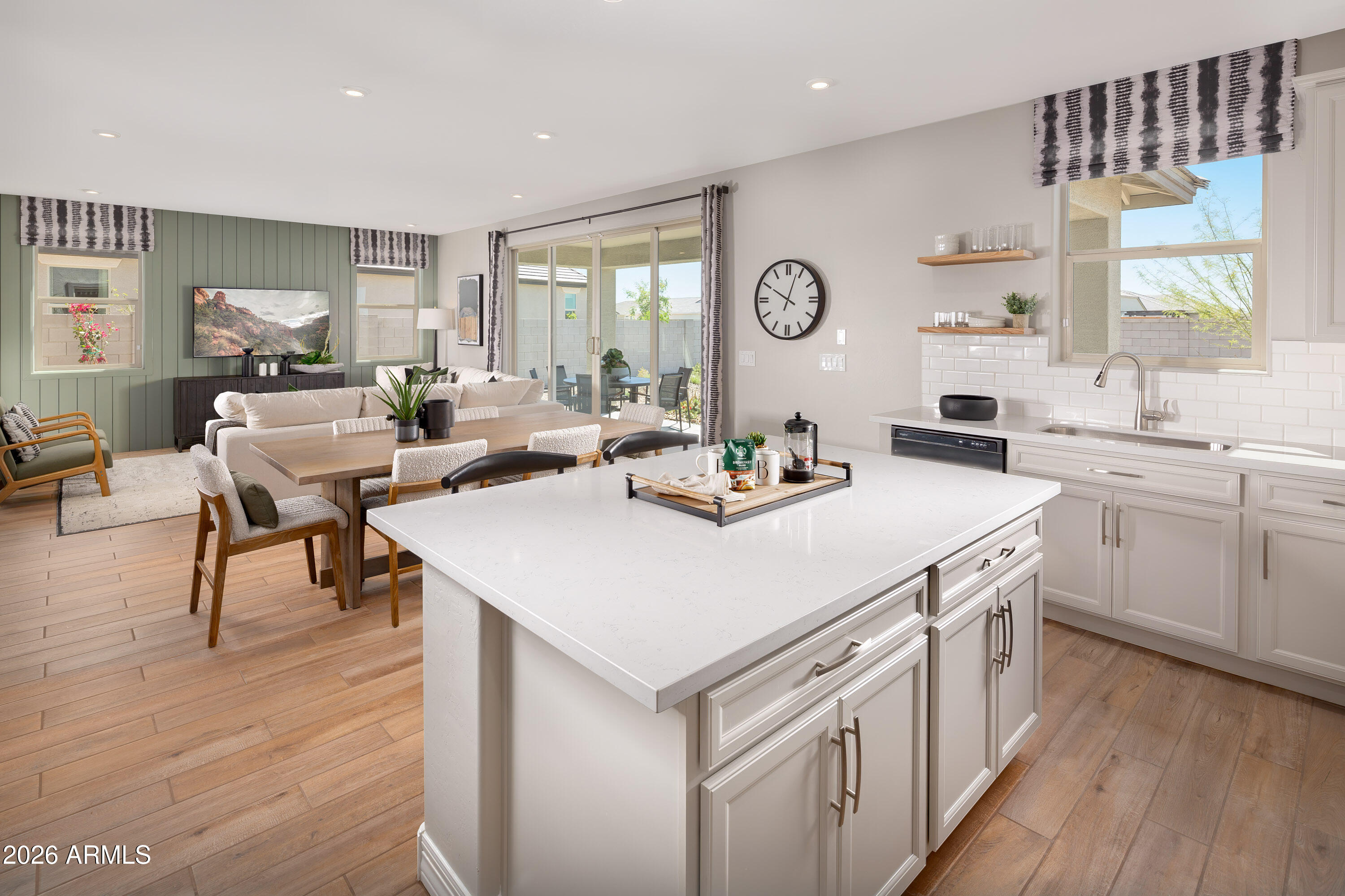 18828 North Ponte Road Maricopa, AZ 85138 - Photo 4 of 25 a kitchen that has a lot of cabinets a sink and a stove in it