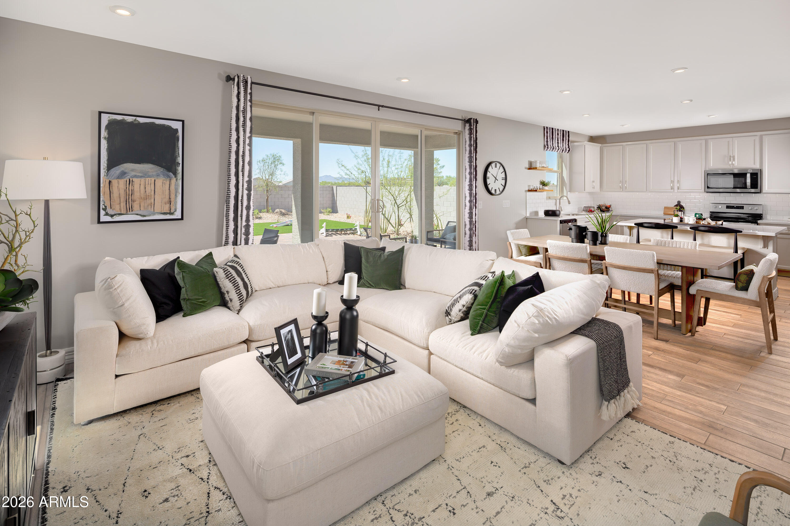 18828 North Ponte Road Maricopa, AZ 85138 - Photo 6 of 25 a living room with furniture and a large window