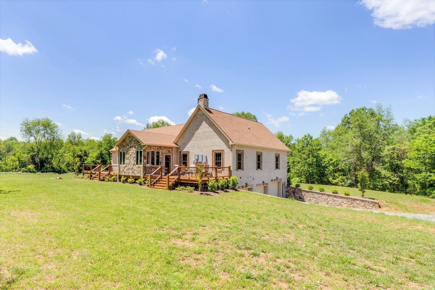 800 Butler Road Portland, TN 37148 - Photo 11 of 38 a view of a house with a yard and garage